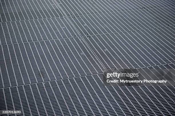 ventilation iron grid on urban area. - perforated metal stock pictures, royalty-free photos & images