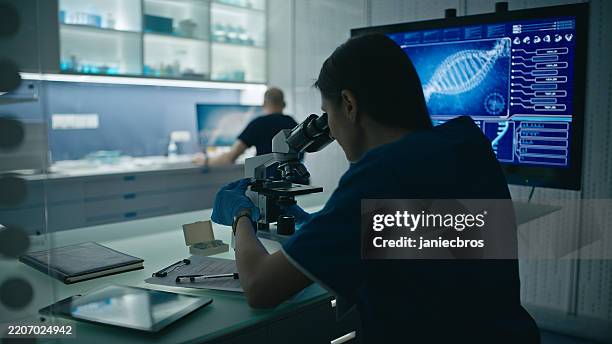 female scientist work in modern medical facility, analyzing dna samples - human dna stock pictures, royalty-free photos & images