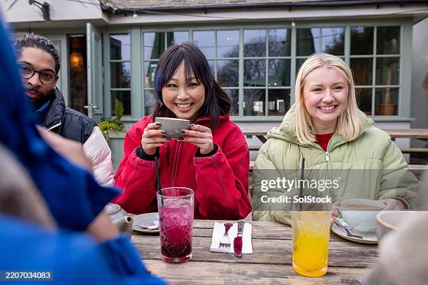 afternoon tea and conversations - outdoor dining winter stock pictures, royalty-free photos & images