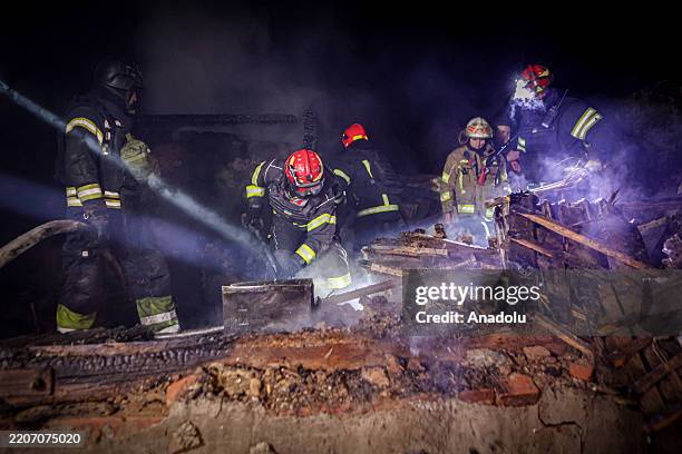 Rescuers dig up the body of a person who died as a result of Russian drone attack on Kharkiv, Ukraine on March 29, 2025. Two people were killed in a...