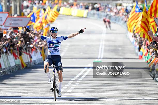 Team Bora's Primoz Roglic celebrates as he crosses the finish line to win the 7th and final stage of the 2025 Volta a Catalunya cycling tour of...