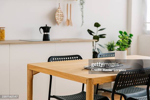 modern home office setup in a cozy kitchen environment - empty school dining hall stock pictures, royalty-free photos & images