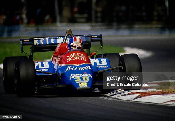 Jo Gartner from Austria driving the Kelemata Osella Squadra Corse Osella FA1F Alfa Romeo 890T V8t lifts a wheel over the curb during the Formula One...