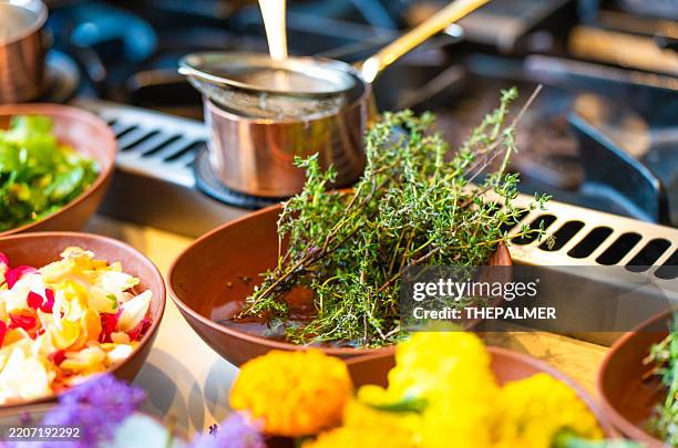 fresh herbs in rustic bowls for culinary use - thyme stock pictures, royalty-free photos & images