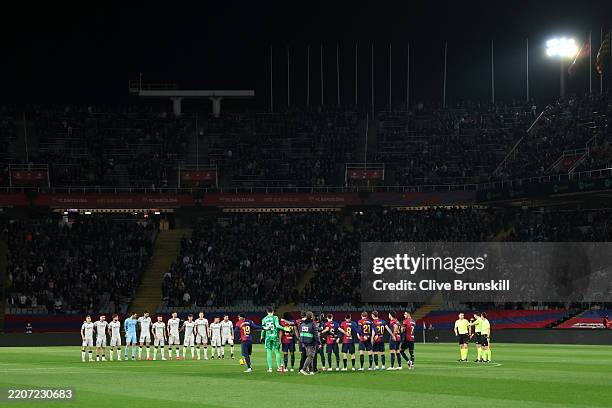 Players, match officials and fans take part in a minute's silence in memory of Dr. Carles Minarro Garcia of FC Barcelona prior to the La Liga EA...