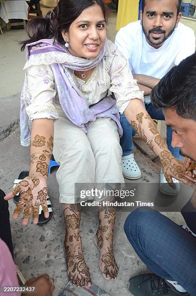Muslim ladies applying Mehndi on the eve of Eid-Ul-Fitr at Maurya Lok Complex , on March 30, 2025 in Patna, India.