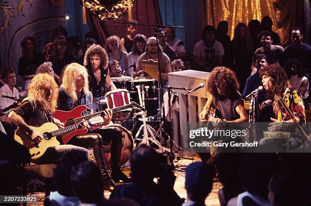 View of members of American Rock group Aerosmith during a performance, for 'MTV Unplugged,' at the Ed Sullivan Theatre, New York, New York, August...