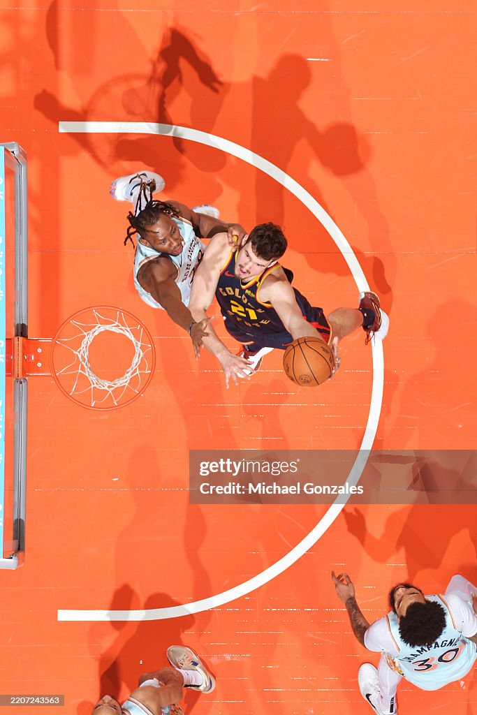 Quentin Post Quinten Post of the Golden State Warriors drives to the basket during ...