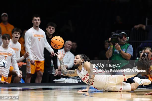 Houston Cougars guard Emanuel Sharp tries to save the ball before it goes out of bounds against the Tennessee Volunteers during the Elite Eight round...