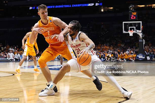 Houston Cougars guard Emanuel Sharp handles the ball while defended by Tennessee Volunteers forward Igor Milicic Jr. #7 during the Elite Eight round...