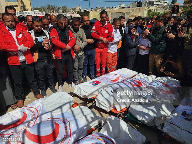Funeral prayer held at Nasser Hospital in Khan Yunis, located in the southern Gaza Strip, for 8 health workers from the Palestinian Red Crescent who...