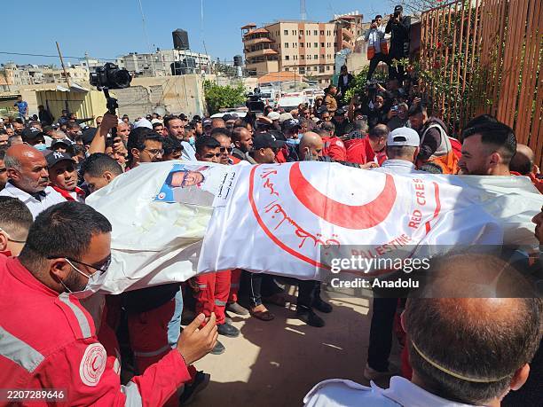 Funerals held at Nasser Hospital in Khan Yunis, located in the southern Gaza Strip, for 8 health workers from the Palestinian Red Crescent who were...
