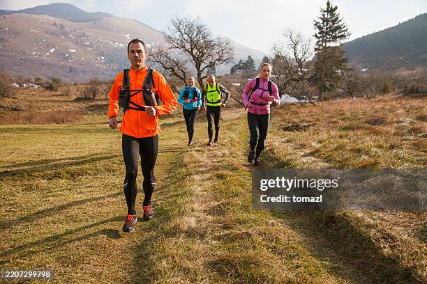 group of trail runners training in nature - self discipline stock pictures, royalty-free photos & images