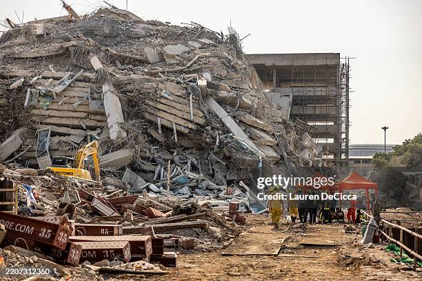 Thai rescue workers arrive on scene at a construction building collapse in the Chatuchak area following an earthquake on March 28, 2025 in Bangkok,...