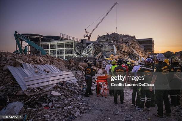 Thai rescue teams provide aid at a construction building collapse in Bangkok's Chatuchak area on March 28, 2025 in Bangkok, Thailand. A powerful 7.7...