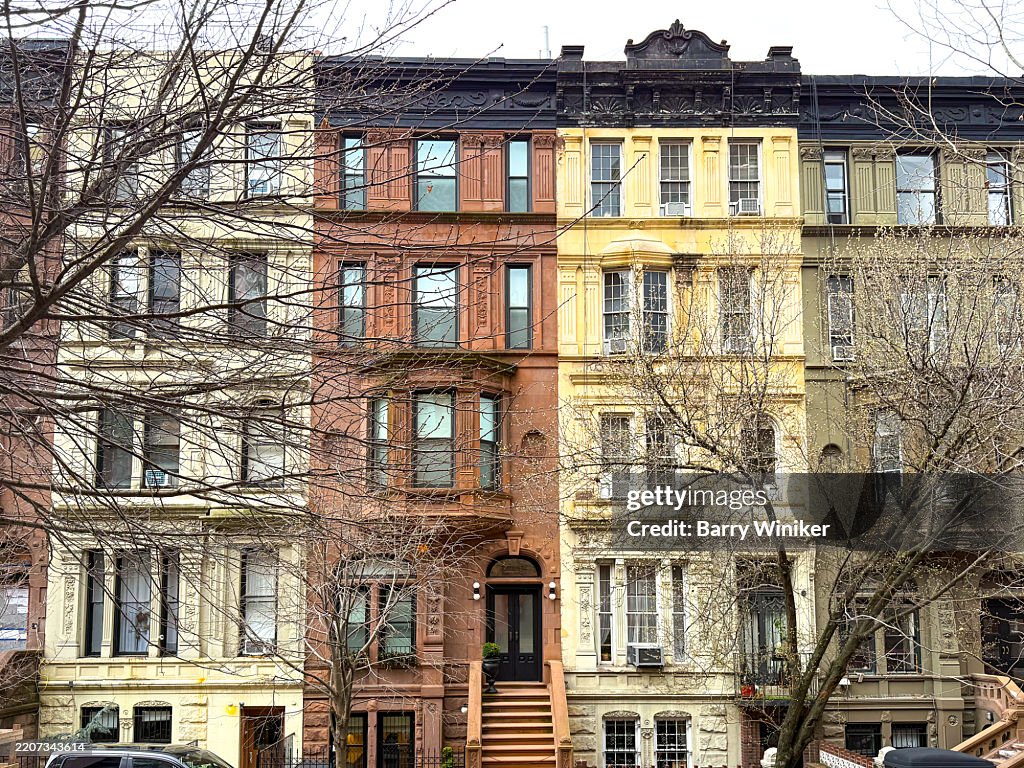 Series of painted row houses, Upper West Side, NYC