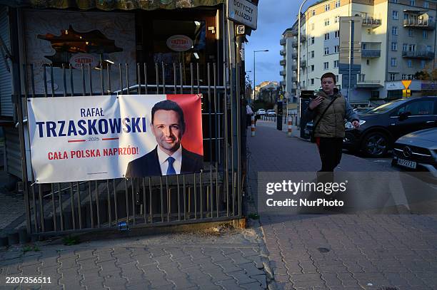 Banner shows Warsaw Mayor Rafal Trzaskowski, the Presidential candidate for Tusk's Civic Platform ahead of May's Presidential elections in Warsaw,...