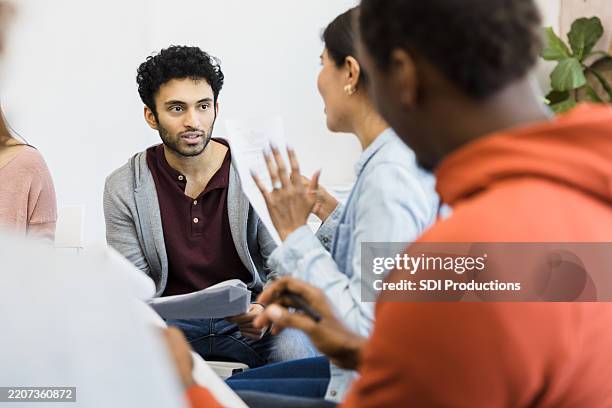group therapy session: diverse people discussing mental health - actors studio foto e immagini stock