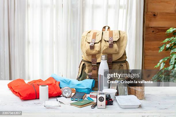 emergency backpack with survival gear displayed - survival stock pictures, royalty-free photos & images