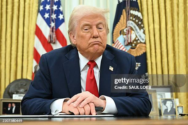 President Donald Trump speaks as he signs an executive order targeting ticket scalping in the Oval Office of the White House in Washington, DC, on...