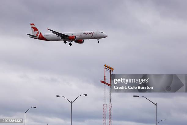 An Air Canada plane approaches the runway as it arrives at the Toronto Pearson International Airport on March 31, 2025 in Toronto, Ontario, Canada....