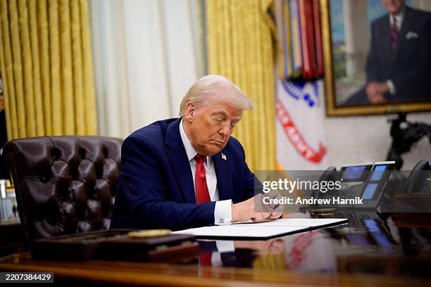 President Donald Trump attends an executive order signing event in the Oval Office of the White House on March 31, 2025 in Washington, DC. Trump has...