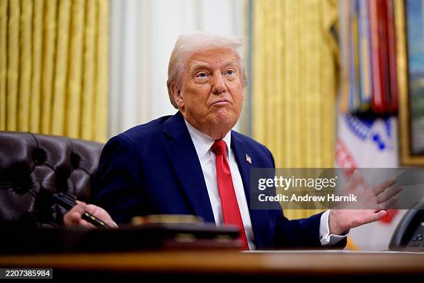 President Donald Trump gestures while speaking during an executive order signing event in the Oval Office of the White House on March 31, 2025 in...