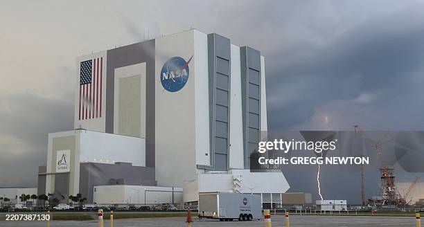 Lightning strikes near the Vehicle Assembly Building ahead of the Fram2 mission launch at the Kennedy Space Center in Cape Canaveral, Florida on...