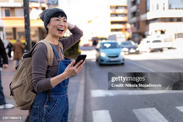 waiting for a cab - dungarees stock pictures, royalty-free photos & images
