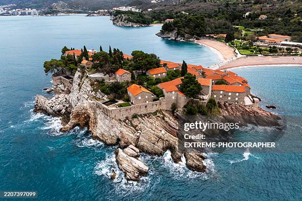 beautiful island of sveti stefan seen from a helicopter point of view - montenegro stock pictures, royalty-free photos & images