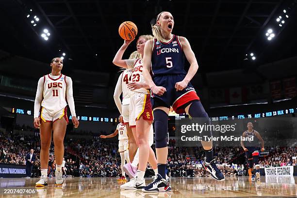 Paige Bueckers of the UConn Huskies reacts to a play under the basket against the USC Trojans during the Elite Eight round of the 2025 NCAA Women's...