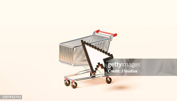online purchase in motion: large cursor on shopping cart icon - computer mouse definition fotografías e imágenes de stock