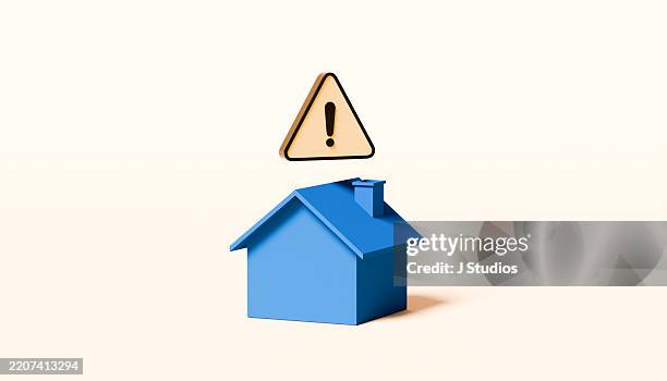 house symbol with yellow warning triangle hovering above – home safety and risk awareness - construction mistake stock pictures, royalty-free photos & images