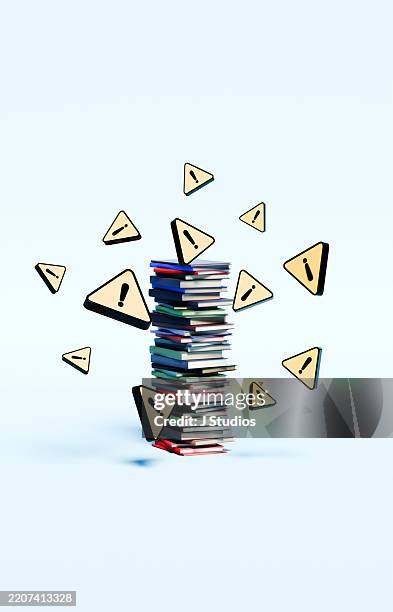 stack of books surrounded by hovering yellow warning triangles – information and caution concept - data error stock pictures, royalty-free photos & images