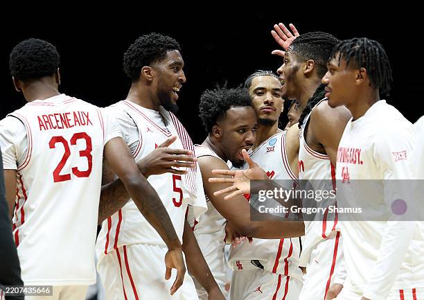 Ja'Vier Francis of the Houston Cougars celebrates with teammates after defeating the against the Purdue Boilermakers 62-20 in the Midwest Regional...
