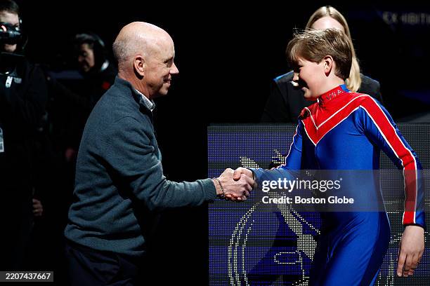 Boston, MA Former American figure skater and Olympic medalist Scott Hamilton, left, shakes hands with Eliy Ribaudo of the Skating Club of Boston...