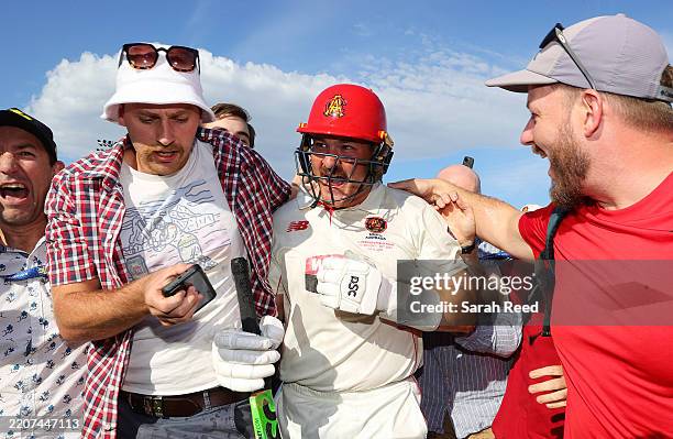 Ben Manenti of South Australia tries to get off the oval as fans storm the pitch after South Australian won the Shield during the Sheffield Shield...