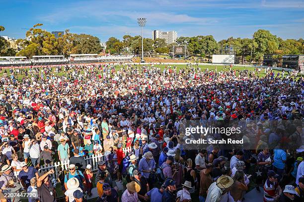 Fans storm the oval after SA won the Shield title during the Sheffield Shield match between South Australia and Queensland at Karen Rolton Oval, on...