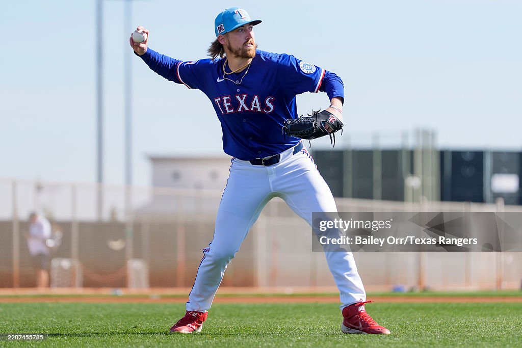 Texas Spring Training Daniel Robert of the Texas Rangers prepares to throw a ball during a ...