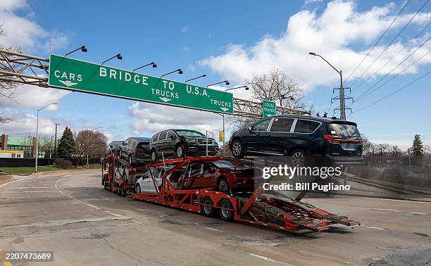 Car hauler truck makes its way to the Ambassador Bridge to cross into the United States at Detroit on April 1, 2025 in Windsor, Canada. U.S....