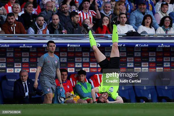 Assistant Referee Rodríguez Moreno reacts as he falls over after colliding with Giuliano Simeone of Atletico de Madrid during the LaLiga match...
