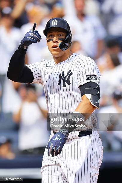 Aaron Judge of the New York Yankees celebrates after hitting a home run in the first inning against Milwaukee Brewers at Yankee Stadium on March 29,...
