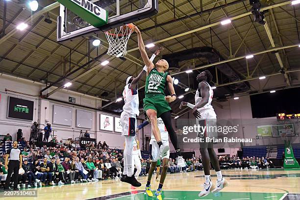 Jordan Walsh of the Maine Celtics dunks the ball during the game against the Capital City Go-Go during the G League Conference Quarter Finals on...