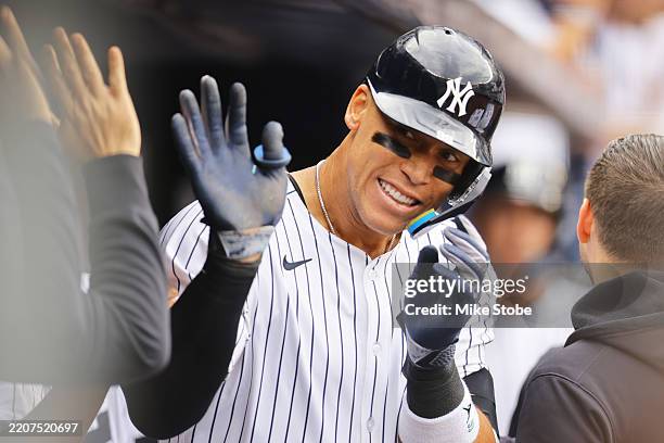Aaron Judge of the New York Yankees celebrates after hitting a two run home run in the fourth inning against the Milwaukee Brewers at Yankee Stadium...