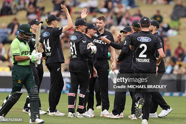 New Zealand's Jacob Duffy celebrates the wicket of Pakistan's Babar Azam during the 2nd one-day international cricket match between New Zealand and...