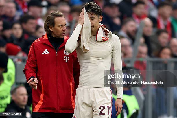 Hiroki Ito of Bayern Munich leaves the field after picking up an injury during the Bundesliga match between FC Bayern München and FC St. Pauli 1910...