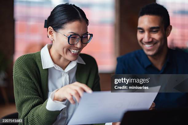 colleagues engaged in a positive discussion during a collaborative work session - using touchscreen stock pictures, royalty-free photos & images