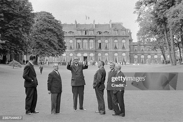French President Charles de Gaulle and President of the Senate Gaston Monnerville welcome their guests during a reception given in honor of French...