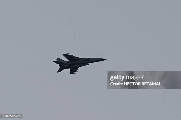Chinese fighter jet flies above Pingtan island, the closest point in China to Taiwan's main island, in Fujian province on April 2, 2025.