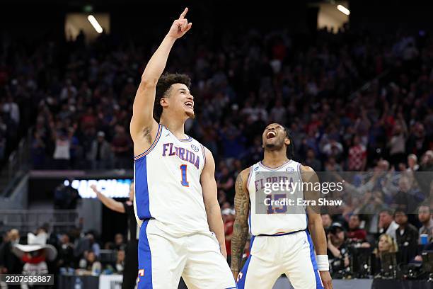 Walter Clayton Jr. #1 and Alijah Martin of the Florida Gators celebrate after defeating the Texas Tech Red Raiders 84-79 in the West Regional Elite...